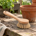 Potting Bench Cleaning Brush — AI-generated styling illustration